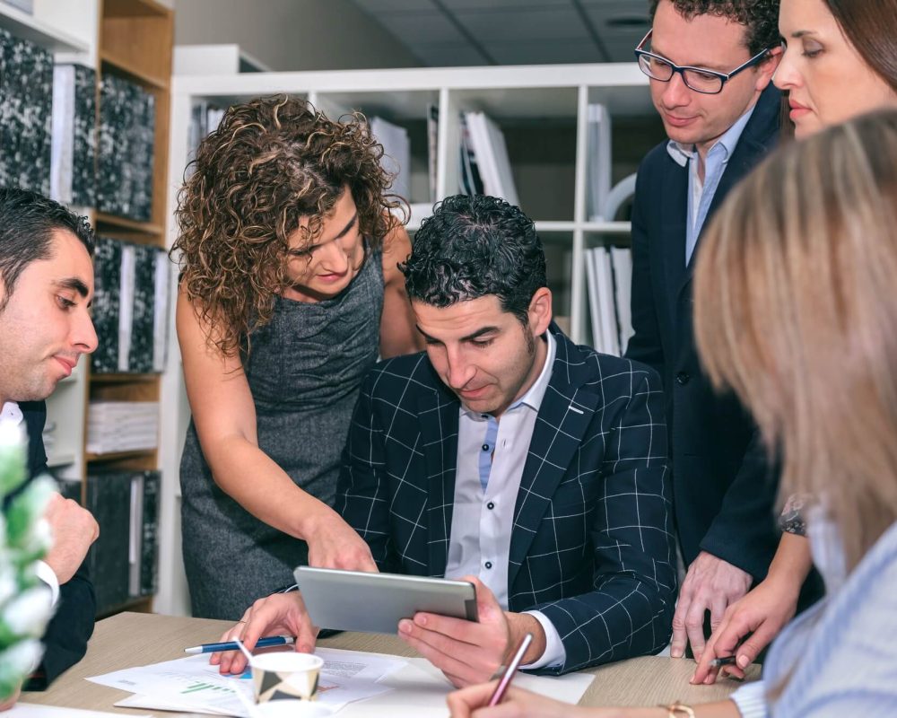 teamwork-looking-business-document-in-electronic-tablet-1.jpg teamwork-looking-business-document-in-electronic-tablet-1.jpg